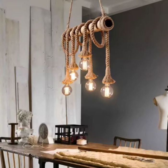 Suspension corde et bois avec ampoules LED rétro, idéale pour une décoration artisanale et une ambiance chaleureuse.