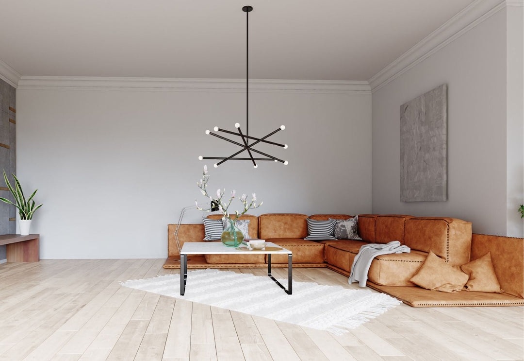 Suspension design noire à branches lumineuses dans un salon moderne aux lignes épurées.