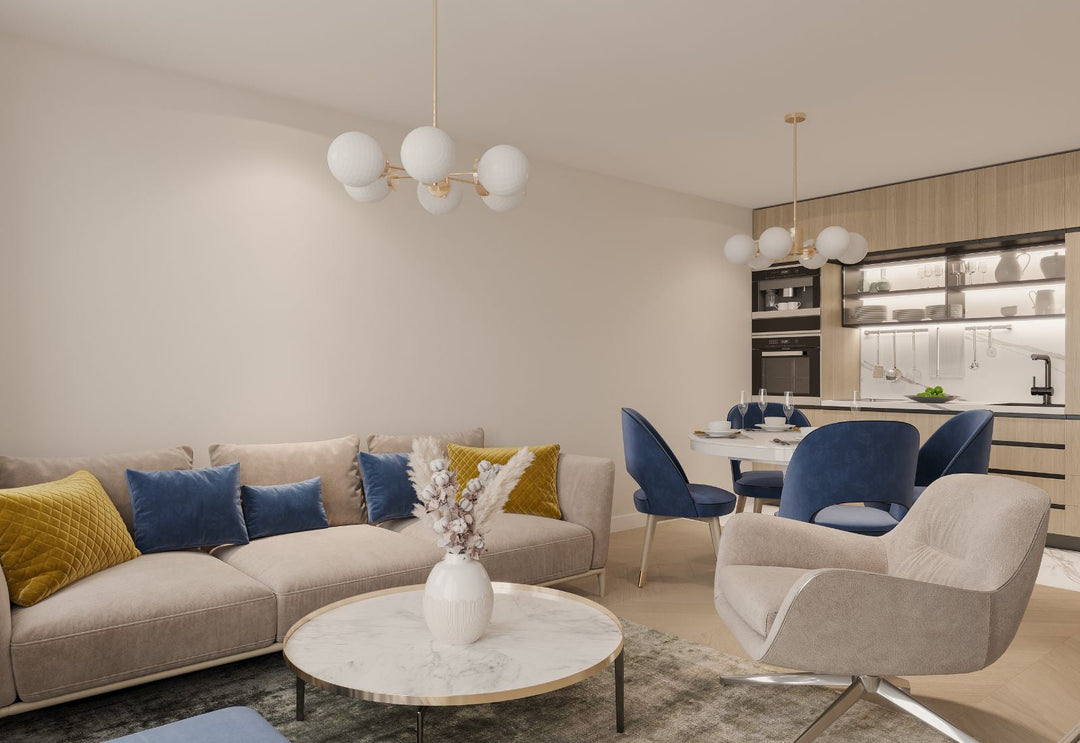 Suspensions en verre opalin blanc diffusant une lumière douce dans un salon ouvert sur cuisine, pour une ambiance apaisante et élégante.