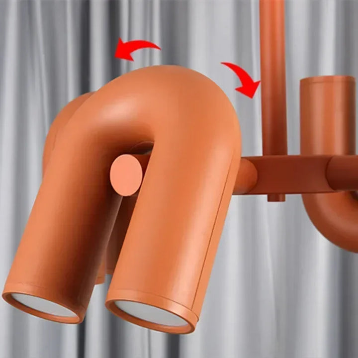 Vue latérale de la suspension design tubulaire aux courbes en U, présentée sous un angle de gauche à droite pour mettre en valeur son design élégant et sa structure métallique
