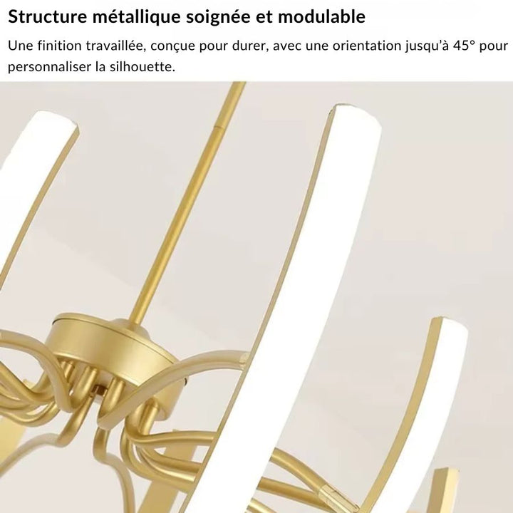 Détail de la structure métallique dorée du lustre araignée, avec bras LED orientables au style élégant et contemporain.