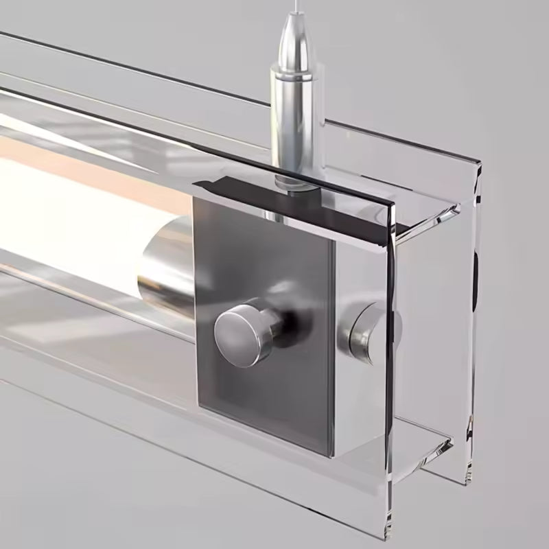 Gros plan sur la fixation en acier inoxydable et l’écrin de verre encadrant le tube lumineux au design épuré