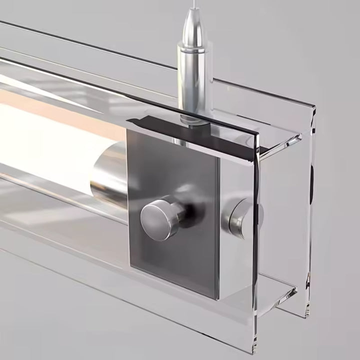 Gros plan sur la fixation en acier inoxydable et l’écrin de verre encadrant le tube lumineux au design épuré