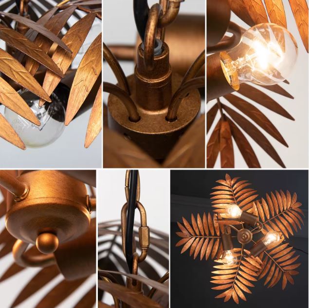 Détails de la suspension palmier en métal cuivré, avec feuillage décoratif et ampoules visibles pour un rendu lumineux exotique.