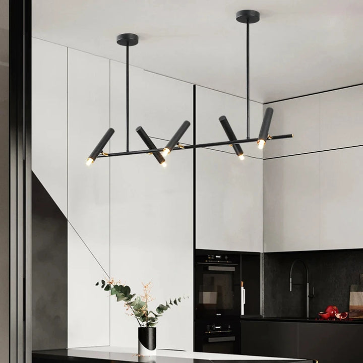 Éclairage suspendu minimaliste à cylindres LED orientés dans un intérieur moderne.