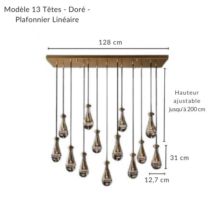 Luminaire rectangulaire doré élégant avec gouttes d'eau suspendues, parfait pour une décoration sophistiquée.