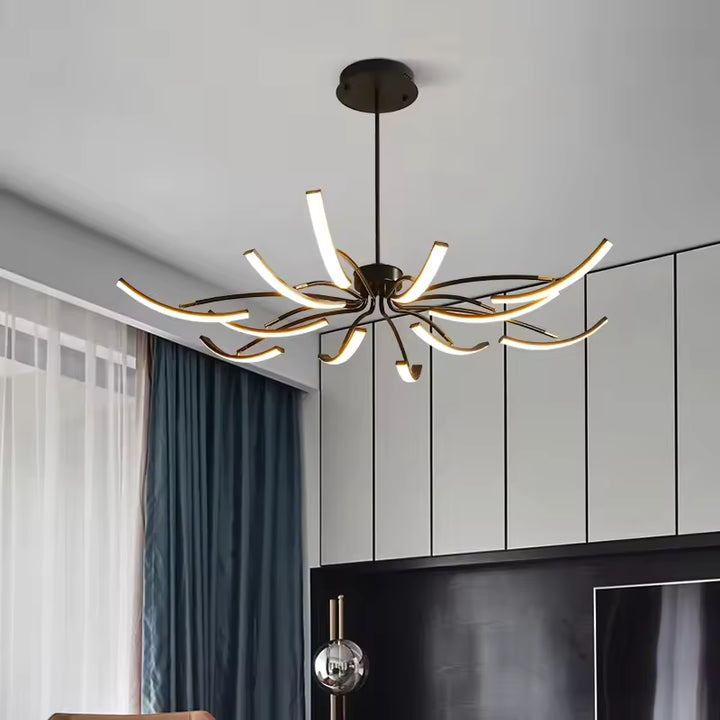 Silhouette aérienne d’un lustre araignée aux bras LED courbés, pensée pour un salon moderne au style graphique et contemporain.