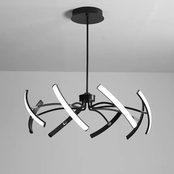 Vue rapprochée d’un lustre araignée noir à bras LED orientables, au style graphique, moderne et sculptural.
