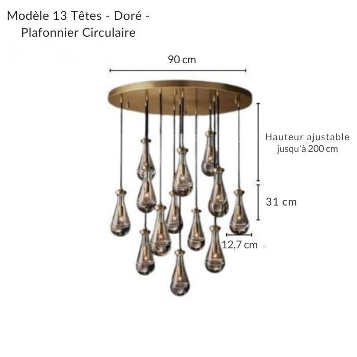 Lustre doré composé d'une cascade de gouttes d'eau en verre, apportant luxe et luminosité à votre espace.