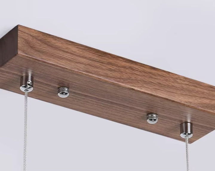 Barre de fixation d'un lustre en noyer à éclairage LED intégré, au design linéaire et minimaliste