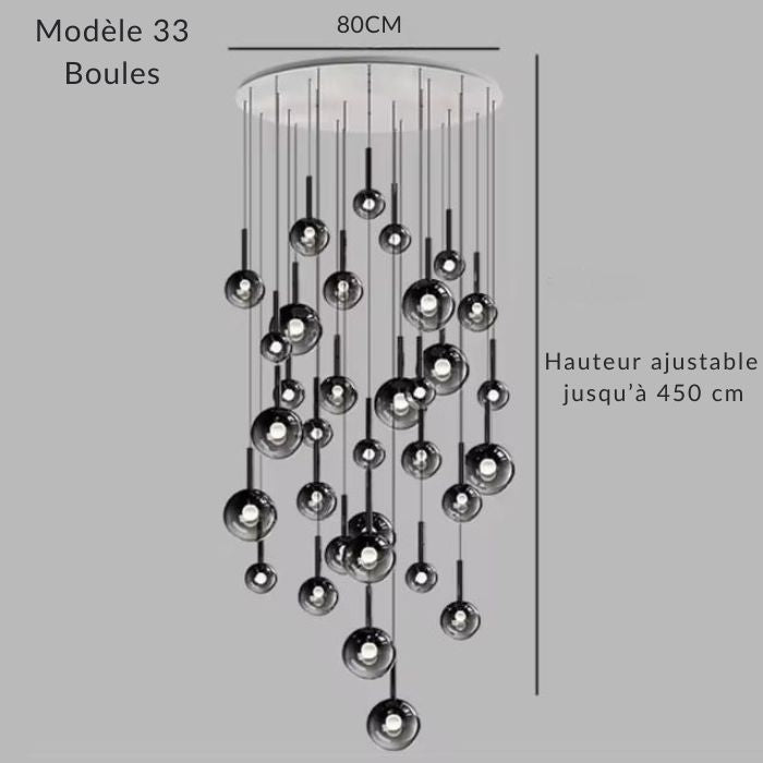 Lustre XXL 33 globes en verre fumé noir, base 80 cm, ambiance luxe moderne en double hauteur.
