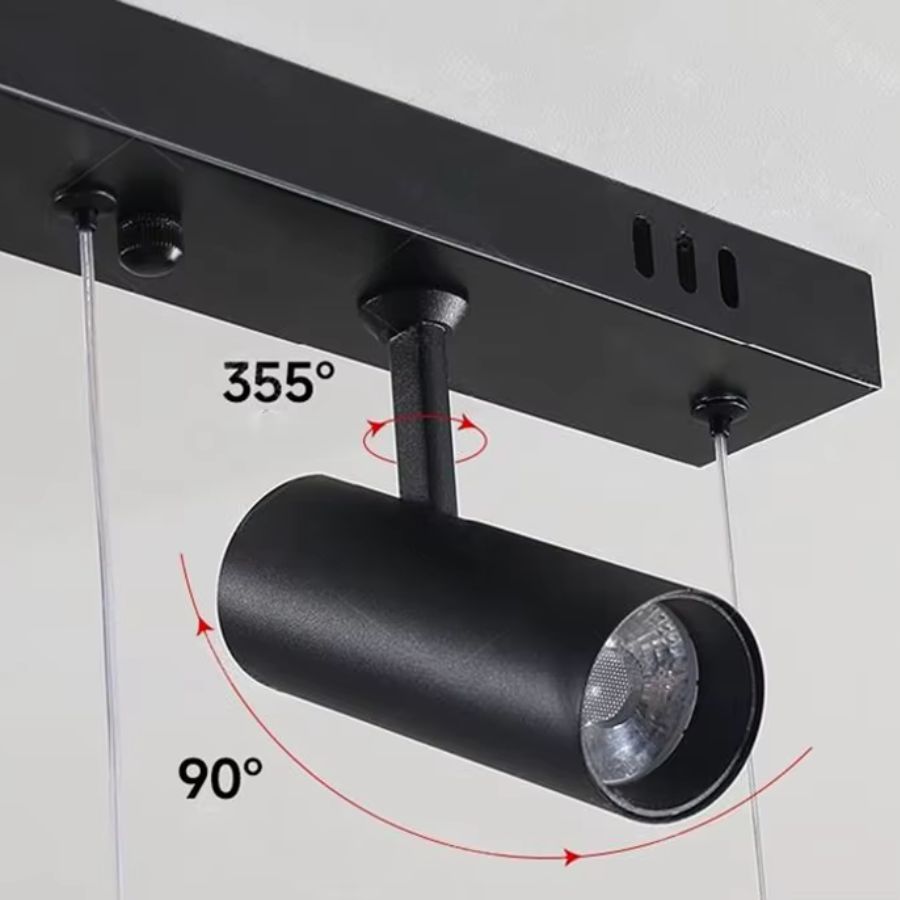 Détail du spot noir orientable à 355° et inclinable à 90° intégré à la suspension linéaire design