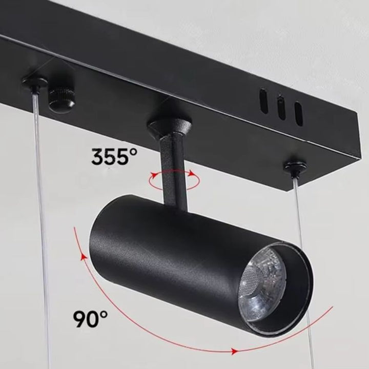 Détail du spot noir orientable à 355° et inclinable à 90° intégré à la suspension linéaire design
