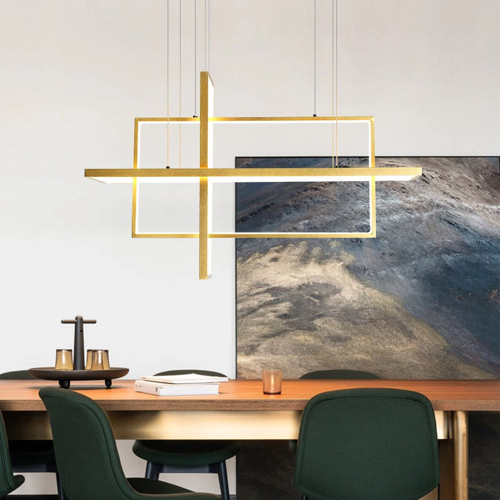Suspension barre architecturale à cadres entrelacés au design moderne, installée au-dessus d'une table de salle à manger.