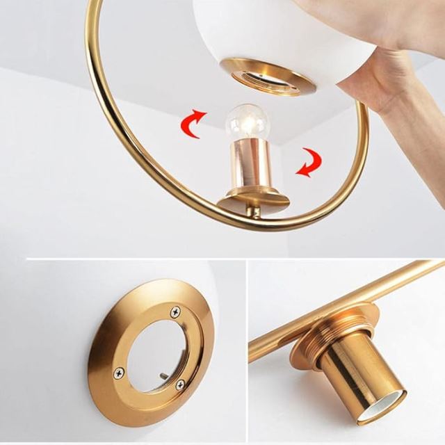 Détails de montage pour une suspension blanche et dorée, pratique et élégante.
