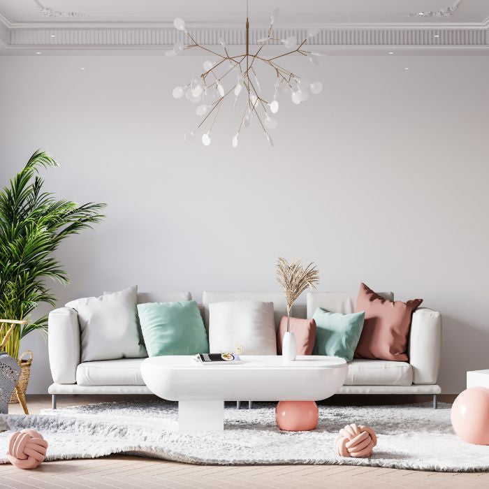 Suspension branche au design organique et aérien, idéale pour créer une ambiance moderne et poétique dans un salon lumineux.