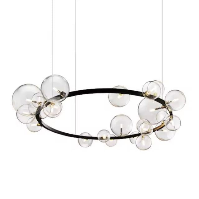 Suspension bulle ronde en verre transparent avec structure noire, idéale pour un éclairage moderne et minimaliste.