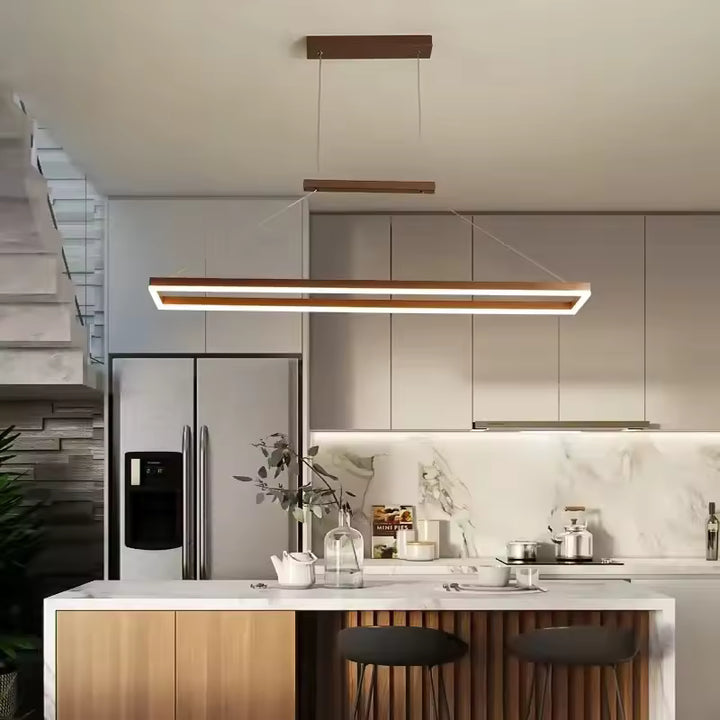 Suspension cadre LED flottant au style design et minimaliste installée au-dessus d’un îlot de cuisine moderne