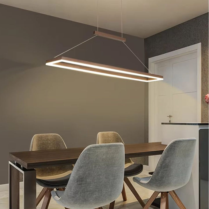 Suspension cadre rectangulaire LED marron au style moderne épuré, suspendue au-dessus d’une table de salle à manger