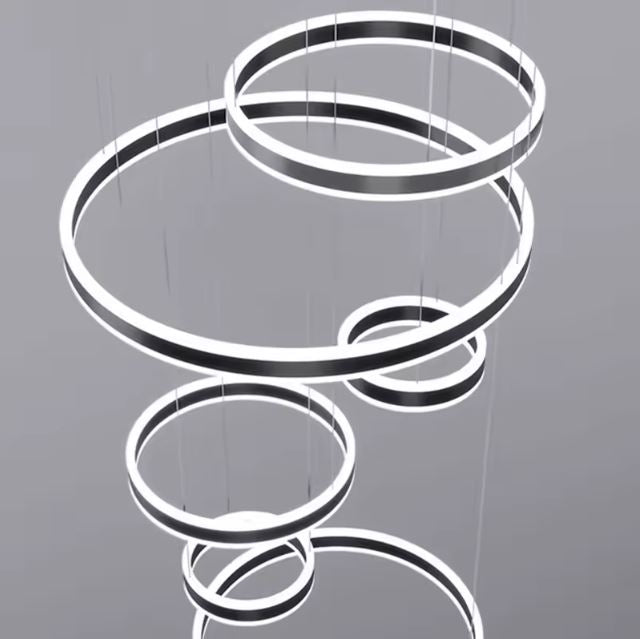 Suspension cerceau LED en gros plan, mettant en valeur l’élégance des anneaux lumineux dans un style sculptural.
