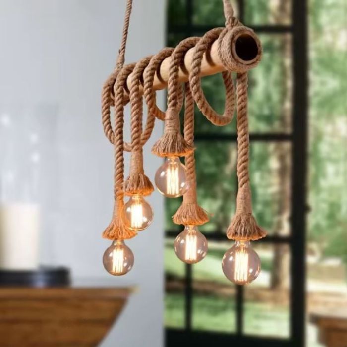 Suspension corde et bois avec ampoules LED vintage, parfaite pour une décoration naturelle et une ambiance chaleureuse.