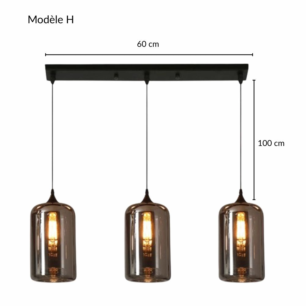 Suspension à abat-jours cylindriques en verre fumé pour un intérieur au design moderne.