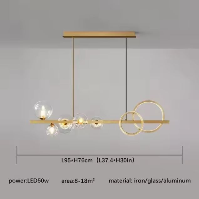 Suspension dorée avec globes transparents et anneaux LED, offrant un éclairage lumineux et contemporain avec hauteur ajustable jusqu’à 60 cm.