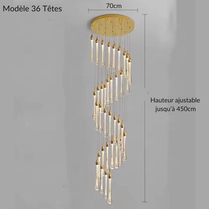 Suspension LED en cascade à 36 gouttes dorées, diamètre 70 cm et hauteur réglable jusqu’à 450 cm, idéale pour escaliers ouverts.
