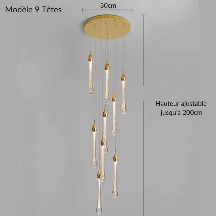 Suspension LED goutte dorée à 9 têtes avec câbles ajustables jusqu’à 200 cm, parfaite pour escaliers, mezzanine ou duplex moderne.