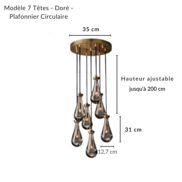 Suspension circulaire avec grappe de gouttes d'eau en verre et détails dorés, style chic pour un intérieur.