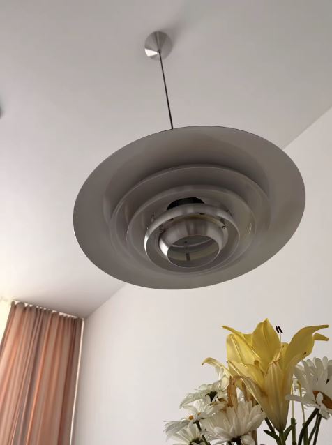 Vue de dessous d'une suspension scandinave vintage à disques concentriques, inspirée du design moderniste nordique.