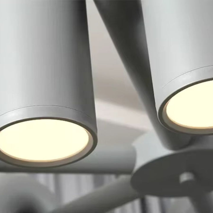 Détail des tubes lumineux LED d’une suspension grise au design minimaliste et aux lignes architecturales