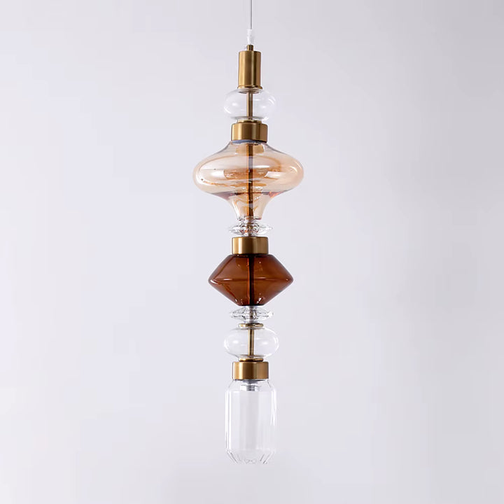 Suspension à silhouette verticale en verre transparent et ambré, rythmée par des formes sculpturales au charme vintage raffiné