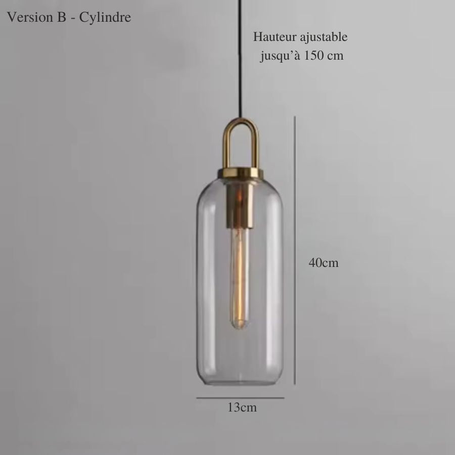 Suspension en verre transparent de forme cylindrique avec anse dorée et éclairage vertical minimaliste
