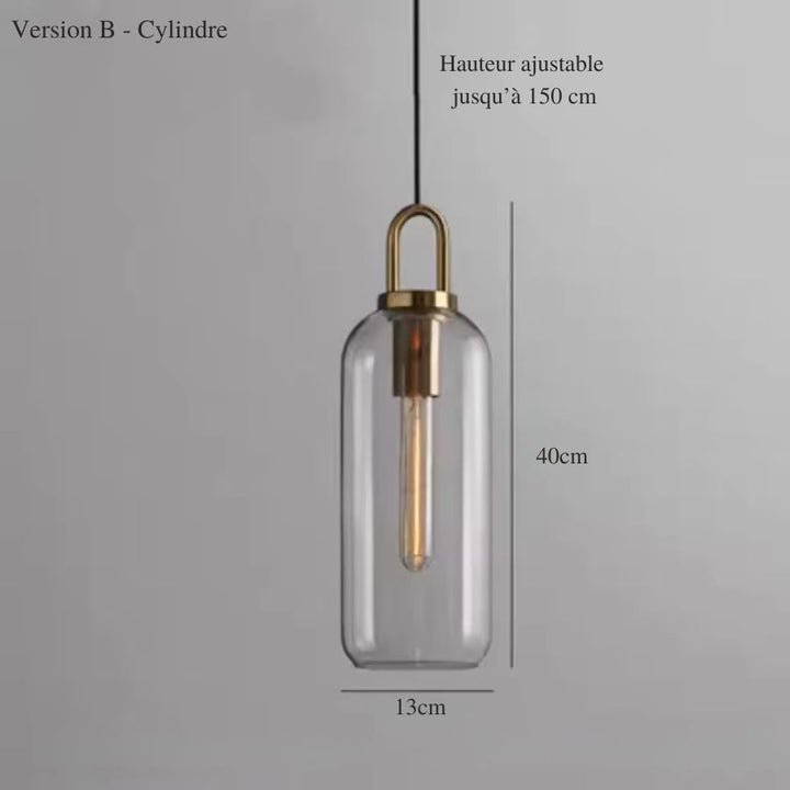 Suspension en verre transparent de forme cylindrique avec anse dorée et éclairage vertical minimaliste