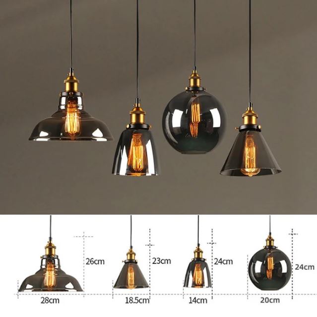 Variété de suspensions industrielles en verre avec différentes formes et tailles, adaptées à tous les styles d'intérieur.